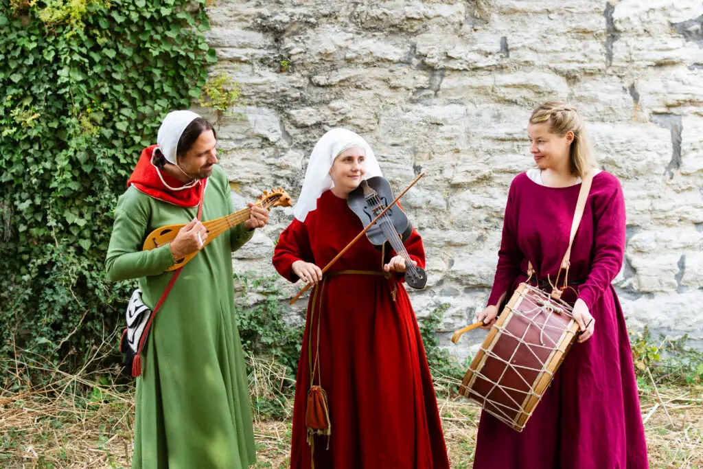 Musicians playing by the medieval wall in Visby, Sweden