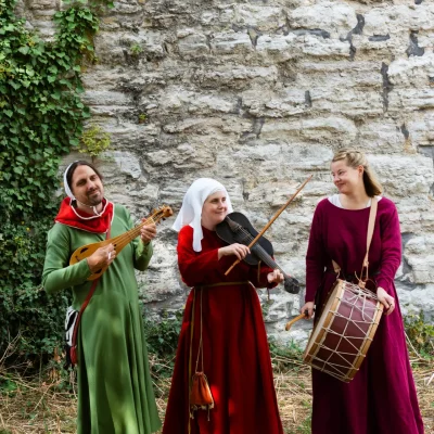 Musicians playing by medieval wall in Visby, Sweden